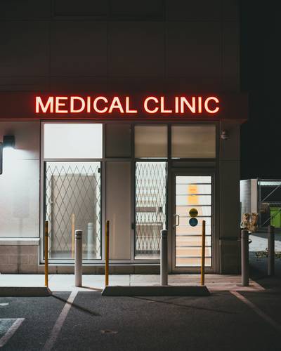 Attorney and client reviewing medical records for a malpractice claim