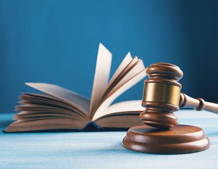 Attorney explaining wrongful death settlement distribution and tax implications to a family