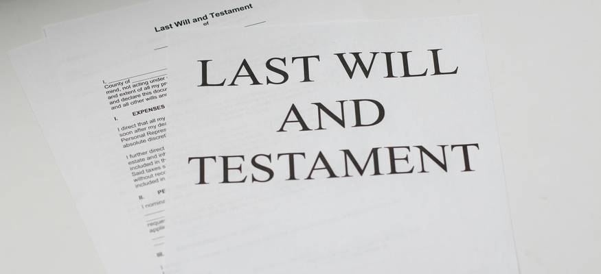 Family members meeting with an attorney to review wrongful death settlement paperwork and discuss legal process